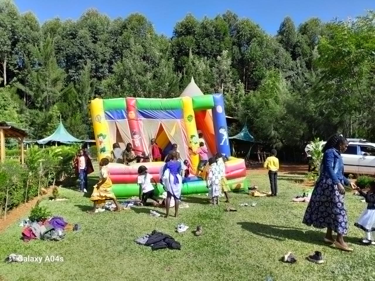 Kids jumping on colorful bouncing castle